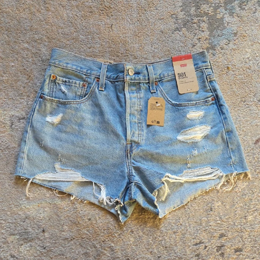 Levi's 501 Light Blue Distressed Jean Shorts‎